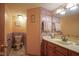 Stylish bathroom featuring stone-look walls, classic vanity, and coordinated fixtures at 7531 Bancaster Dr, Indianapolis, IN 46268