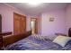 Bedroom featuring a wooden sleigh bed and view to en suite bathroom at 7531 Bancaster Dr, Indianapolis, IN 46268