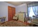 Cozy bedroom features a closet and ample sunlight from the window with decorative valance at 7531 Bancaster Dr, Indianapolis, IN 46268