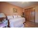 Comfortable bedroom with a daybed and built-in shelving and view to a closet at 7531 Bancaster Dr, Indianapolis, IN 46268