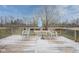 Picture of deck with table and chairs, and a large backyard space at 7531 Bancaster Dr, Indianapolis, IN 46268