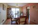 Bright dining room featuring hardwood floors, a large window, and elegant furnishings at 7531 Bancaster Dr, Indianapolis, IN 46268