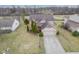 An aerial view of a charming two-story home with a well-manicured lawn and a two-car garage at 7531 Bancaster Dr, Indianapolis, IN 46268