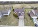 An aerial view showcases the home's roof, neat landscaping, and a long driveway leading to the attached garage at 7531 Bancaster Dr, Indianapolis, IN 46268