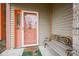 Inviting front door with sidelight, decorative wreath, welcome mat, and cozy bench at 7531 Bancaster Dr, Indianapolis, IN 46268