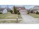 Charming two-story home with attached two-car garage and well-manicured landscaping at 7531 Bancaster Dr, Indianapolis, IN 46268