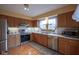 Kitchen with stainless steel appliances, granite counters, and a large window for natural light at 7531 Bancaster Dr, Indianapolis, IN 46268