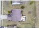 Aerial top-down view of the property, highlighting its roofline, backyard deck, and surrounding landscape at 7531 Bancaster Dr, Indianapolis, IN 46268
