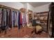 Organized walk-in closet features built-in shelving, drawers, rods, and dedicated shoe storage at 7531 Bancaster Dr, Indianapolis, IN 46268