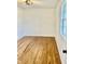 Spacious bedroom featuring wood floors, white walls, and a ceiling fan at 7874 E County Road 200 N, Avon, IN 46123