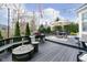 Outdoor back deck with seating, an umbrella, a grill, and a fire pit, perfect for entertaining or relaxing at 8253 Belcrest Ct, Indianapolis, IN 46256