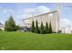 Expansive backyard with a lush green lawn, mature landscaping, and a deck for outdoor enjoyment at 8253 Belcrest Ct, Indianapolis, IN 46256