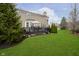 Picturesque backyard showing the spacious lawn and outdoor deck, offering a tranquil retreat at 8253 Belcrest Ct, Indianapolis, IN 46256