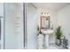 Charming bathroom featuring a pedestal sink, frosted glass shower, and elegant decor, creating a spa-like atmosphere at 8253 Belcrest Ct, Indianapolis, IN 46256