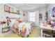 Cheerful bedroom with a colorful bed, desk area, and white shiplap wall at 8253 Belcrest Ct, Indianapolis, IN 46256