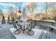 A cozy deck featuring a table, chairs, and a grill, perfect for outdoor relaxation and entertaining at 8253 Belcrest Ct, Indianapolis, IN 46256