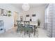 Bright dining room with green chairs, a white table, and decorative lighting at 8253 Belcrest Ct, Indianapolis, IN 46256