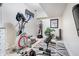 Well-equipped exercise room featuring an elliptical machine, weight bench, and other fitness equipment for a complete workout at 8253 Belcrest Ct, Indianapolis, IN 46256