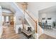 Foyer featuring hardwood floors, staircase, and seating area at 8253 Belcrest Ct, Indianapolis, IN 46256