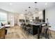 Spacious kitchen with a large island, sleek countertops, modern lighting, and stainless steel appliances at 8253 Belcrest Ct, Indianapolis, IN 46256