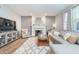Inviting living room with stylish fireplace, neutral furniture, and lots of natural light and open concept at 8253 Belcrest Ct, Indianapolis, IN 46256