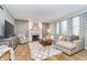 Inviting living room features a fireplace, comfortable seating, and neutral tones with lots of natural light at 8253 Belcrest Ct, Indianapolis, IN 46256
