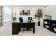 Office with a black desk, neutral carpet, and a decorative ladder at 8253 Belcrest Ct, Indianapolis, IN 46256