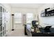 Office featuring a black desk, large windows, and stylish decor at 8253 Belcrest Ct, Indianapolis, IN 46256