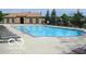 Community pool with tanning chairs, offering a refreshing and relaxing recreational space at 8253 Belcrest Ct, Indianapolis, IN 46256