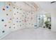 Versatile recreation room featuring a climbing wall and workout area, providing options for fitness and fun at 8253 Belcrest Ct, Indianapolis, IN 46256