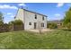 A green backyard with a fence and a view of the back of the house at 8551 Belle Union Ct, Camby, IN 46113