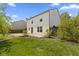 Landscaped backyard featuring a neatly trimmed lawn and a patio at 8551 Belle Union Ct, Camby, IN 46113