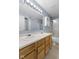 Bathroom features a double sink vanity, a mirror, and a shower with sliding glass doors at 8551 Belle Union Ct, Camby, IN 46113