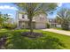 Charming two-story home featuring a brick facade, attached garage, and well-manicured lawn at 8551 Belle Union Ct, Camby, IN 46113