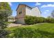 Side view of a two-story home featuring a brick facade, attached garage, and lush lawn at 8551 Belle Union Ct, Camby, IN 46113
