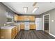 A full view of the kitchen, including the light wood cabinets, and a pantry in the corner at 8551 Belle Union Ct, Camby, IN 46113