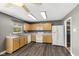 A full view of the kitchen, including the light wood cabinets, and dark floors at 8551 Belle Union Ct, Camby, IN 46113