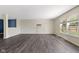 Spacious living room featuring dark wood floors and bright windows at 8551 Belle Union Ct, Camby, IN 46113