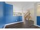 Open-concept living room with dark wood floors and ample natural light at 8551 Belle Union Ct, Camby, IN 46113