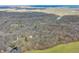 Scenic aerial view of a wooded area with a lake, homes, and surrounding greenery at 8968 Old Haggard Rd, Morgantown, IN 46160
