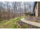 Beautiful backyard with tiered landscaping and a spacious deck at 8968 Old Haggard Rd, Morgantown, IN 46160