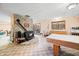 A cozy wood burning fireplace in the basement, along with a kitchenette and access to the backyard at 8968 Old Haggard Rd, Morgantown, IN 46160