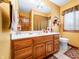 Well-lit bathroom featuring a vanity with a large mirror and neutral wall color at 8968 Old Haggard Rd, Morgantown, IN 46160