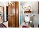 Well-lit bathroom featuring a toilet and glass-enclosed shower, complemented by neutral wall colors at 8968 Old Haggard Rd, Morgantown, IN 46160