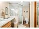 Bathroom featuring a glass enclosed shower, white tiling, and granite countertops at 8968 Old Haggard Rd, Morgantown, IN 46160