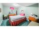 A bedroom furnished with a single bed, dresser and bedside table, creating a cozy and personal space at 8968 Old Haggard Rd, Morgantown, IN 46160