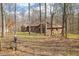 Exterior view of home surrounded by mature trees, showcasing the serene and private setting at 8968 Old Haggard Rd, Morgantown, IN 46160