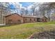 Charming brick home features a well-maintained lawn and beautiful trees at 8968 Old Haggard Rd, Morgantown, IN 46160