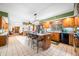 Spacious open-concept kitchen featuring center island with bar seating, custom cabinets, and tile flooring at 8968 Old Haggard Rd, Morgantown, IN 46160