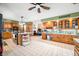 Spacious kitchen offers granite counters, custom cabinets, stainless appliances, and center island with seating at 8968 Old Haggard Rd, Morgantown, IN 46160